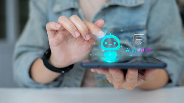istock Close-up hand using a smartphone with a hologram AI chatbot virtual assistant icon. Concept of artificial intelligence, customer service, digital technology, and innovation. 2232187414
