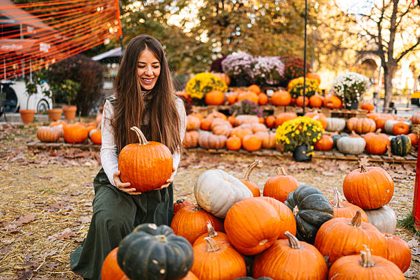 Pile of orange and white pumpkins. The orange pumpkins are larger than the white ones, thanksgiving concept, harvest