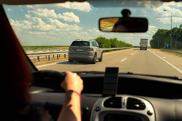 istock Woman driving her car on the highway 2232190374