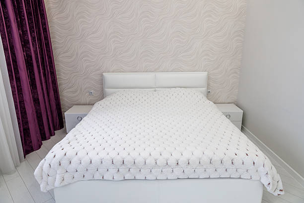 istock Modern Minimalist Bedroom with White Bed and Purple Curtains 2232190421