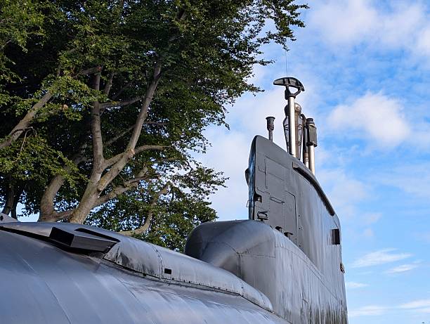 istock Submarine on display surrounded by trees under a bright blue sky 2232195545