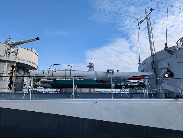 istock Naval ship deck showcasing missile systems and equipment during clear day observations at port 2232195564