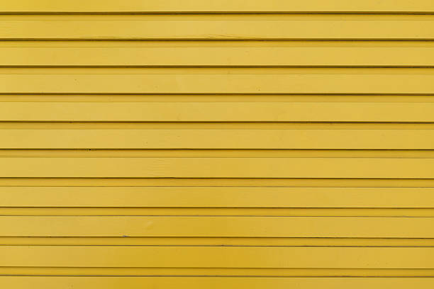 istock Bright yellow striped wooden background, designer backdrop. Copy space 2232196439