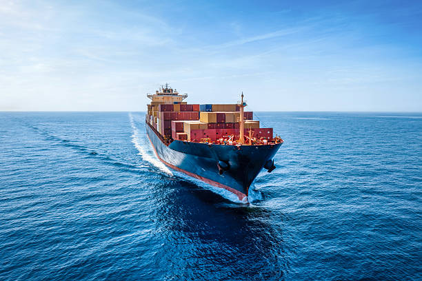 istock Aerial front view of a container cargo ship traveling over the ocean 2232198587