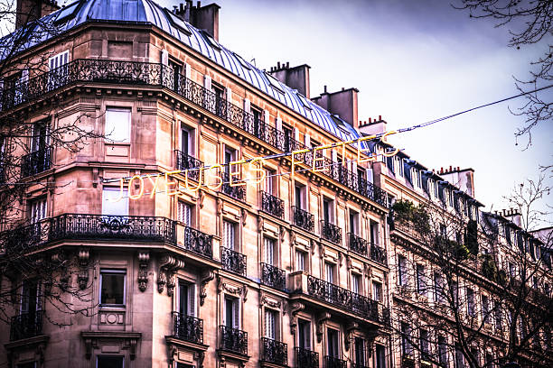 An illuminated banner reading 'Joyeuses Fetes', or 'Happy Holidays' in the run-up to Christmas during December in central Paris.
