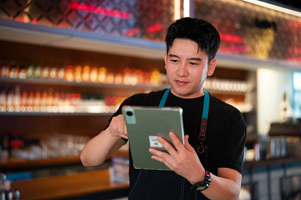 istock Asian handsome man working in a bar 2232200600