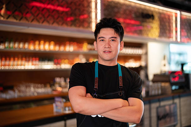 istock Asian handsome man working in a bar 2232200672