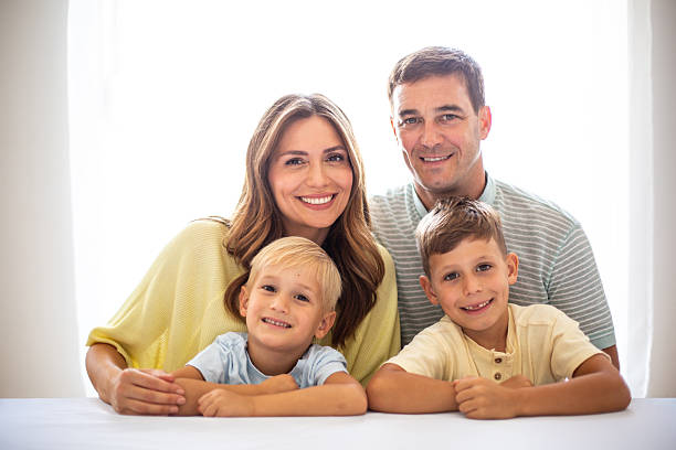 istock Happy family smiling together at home 2232201813