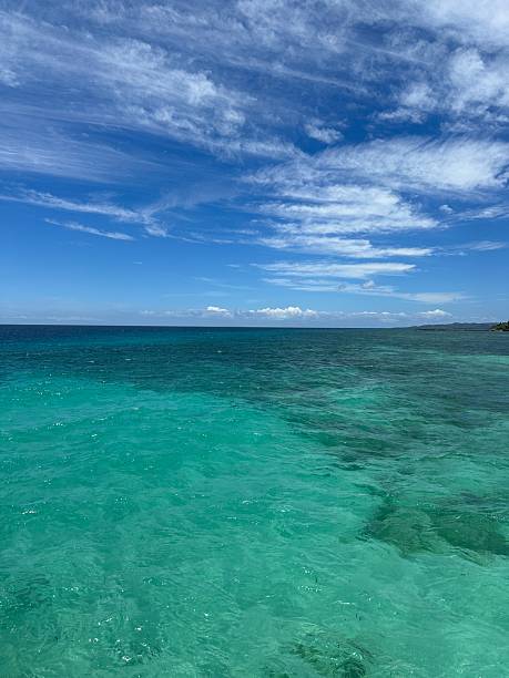 istock Bright blue sky and turquoise waters 2232202756