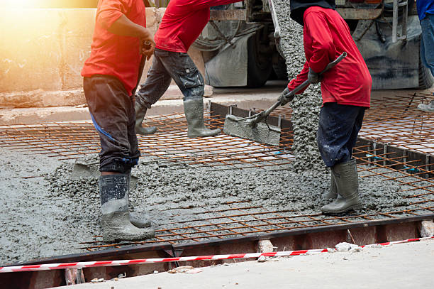 istock Workers are pouring concrete and cement at the construction site. 2232203257