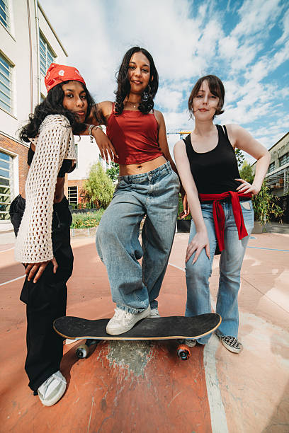 istock Young women posing with skateboard in a skate park 2232209741