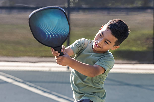 istock Young boy playing pickle ball 2232210338