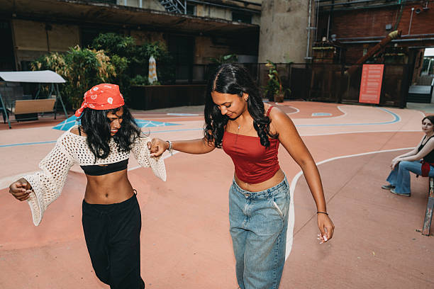 istock Two young women dancing in urban playground 2232210584