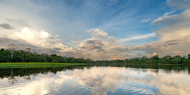 istock Dramatic Sunset Over the Beautiful Untamed Vast Amazon River and the Amazon Rainforest in the Tamshiyacu Tahuayo Regional Conservation Area Near Iquitos, Peru in South America. 2232214545