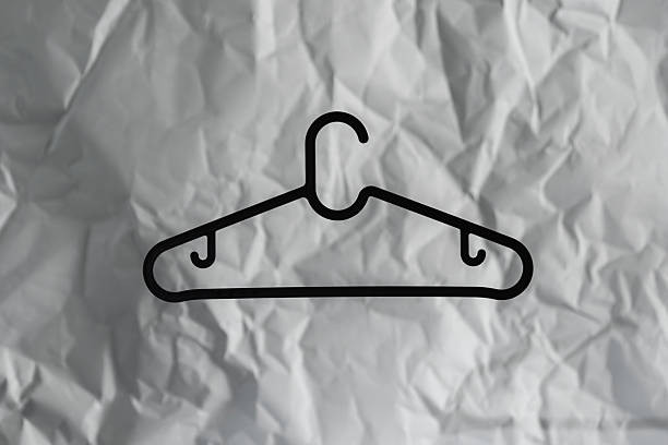 Minimalist Clothes Hanger  on Crumpled Paper Background,
