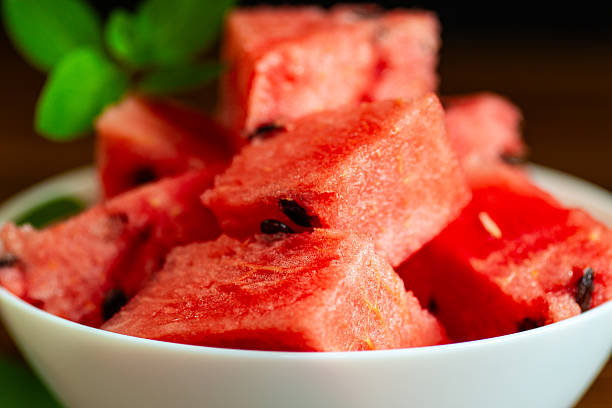 Summer watermelon dessert in a bowl on a dark background