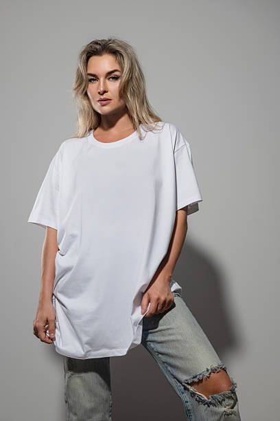istock Confident Woman Wearing Oversized White T-Shirt with Blank Space for Mockup 2232225974
