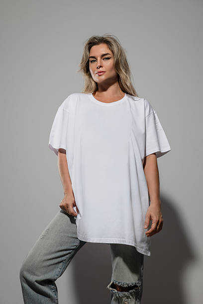 istock Confident Woman Wearing Oversized White T-Shirt with Blank Space for Mockup 2232226405
