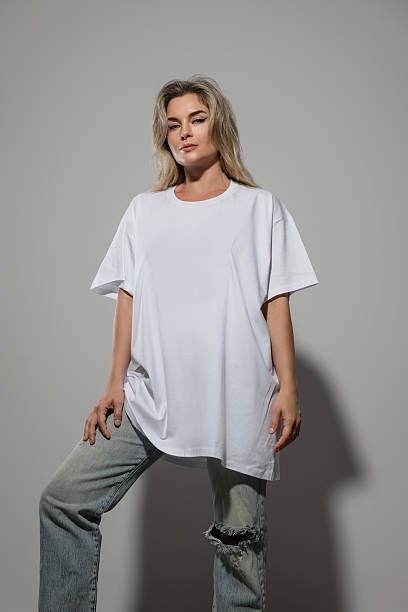 istock Confident Woman Wearing Oversized White T-Shirt with Blank Space for Mockup 2232226567