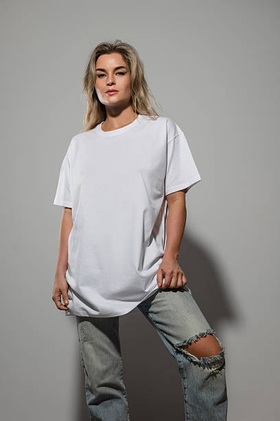 istock Confident Woman Wearing Oversized White T-Shirt with Blank Space for Mockup 2232226740