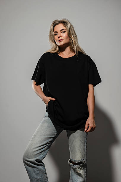 istock Confident Woman Wearing Oversized Black T-Shirt with Blank Space for Mockup 2232227701