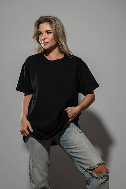 istock Confident Woman Wearing Oversized Black T-Shirt with Blank Space for Mockup 2232227743