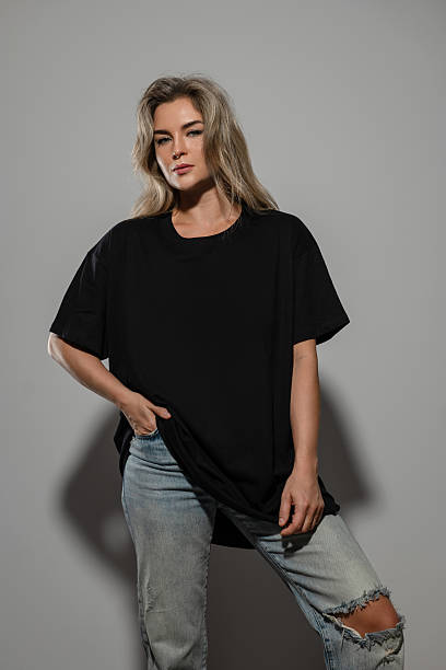 istock Confident Woman Wearing Oversized Black T-Shirt with Blank Space for Mockup 2232228085