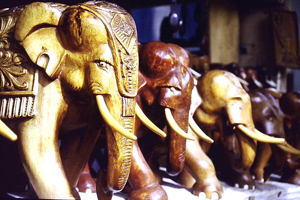 Hand-carved wooden elephant figurines from Sri Lanka, traditional craftsmanship and cultural souvenirs representing Sri Lankan woodcarving art