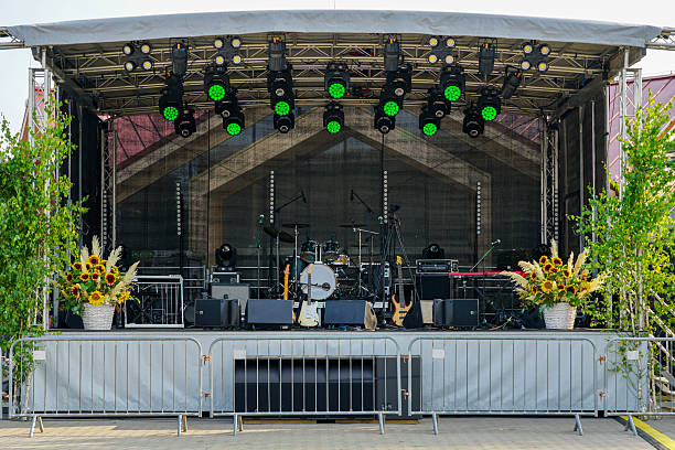 istock Outdoor concert stage with instruments, lights, and decorations prepared for live performance 2232233828