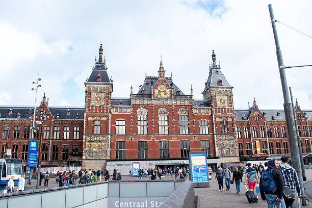 Amsterdam, Netherlands - Aug 21, 2016: A view of the Centraal Station with commuters coming and going.