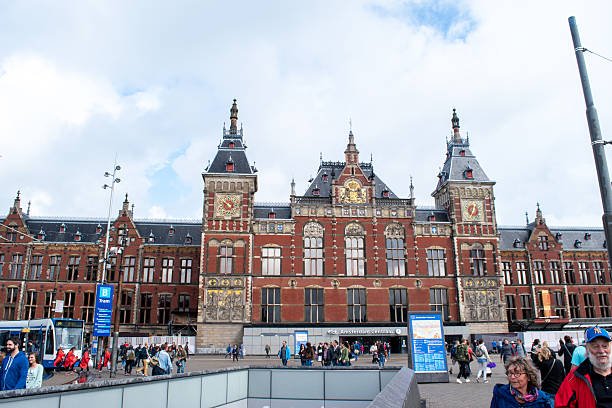 Amsterdam, Netherlands - Aug 21, 2016: A view of the Centraal Station with commuters coming and going.
