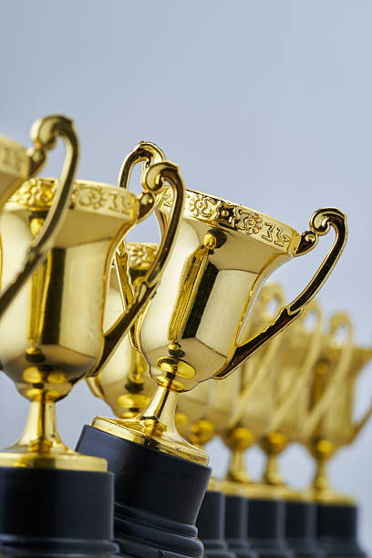 istock group of small trophies against white background 2232236627