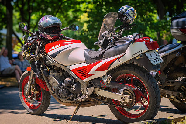 Burgas, Bulgaria - July 05 2025: Yamaha Genesis motorcycle with red and white racing design parked in urban setting. Concept of speed-driven lifestyle, powerful sport bike culture, road performance