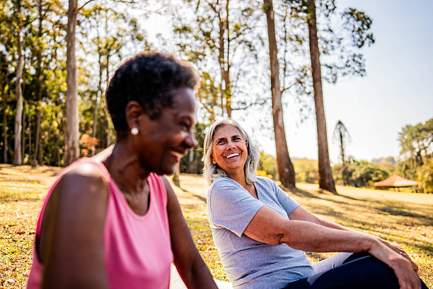 istock Smiling senior friends relaxing on the public park 2232241983