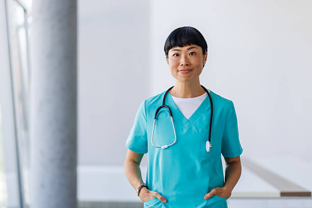 istock Confident asian doctor posing in hospital corridor 2232242140
