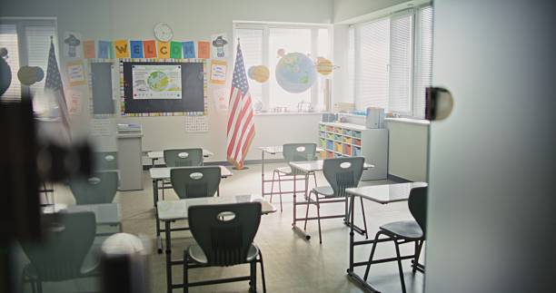 istock American Primary School: Interior of Modern Empty Classroom with Desks for Students 2232246681