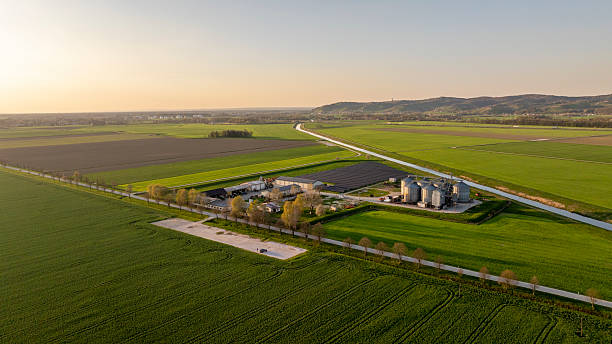 istock Grain Silos and Solar Panels in Verdant Spring Landscape 2232248648