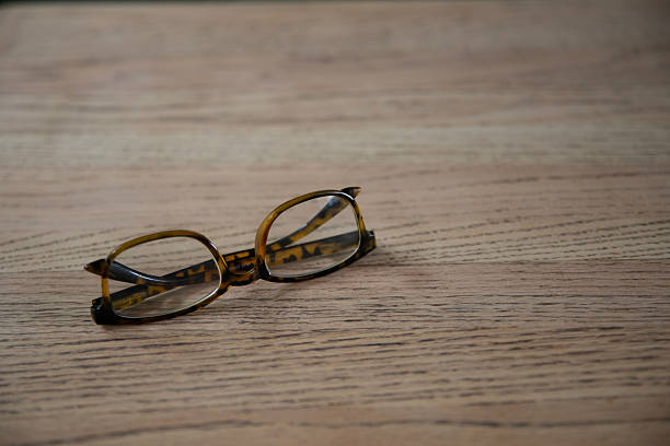 Reading Glasses on Wood Background. Optical Vision. Shot with a Canon EOS Mark V.