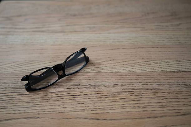 Reading Glasses on Wood Background. Optical Vision. Shot with a Canon EOS Mark V.