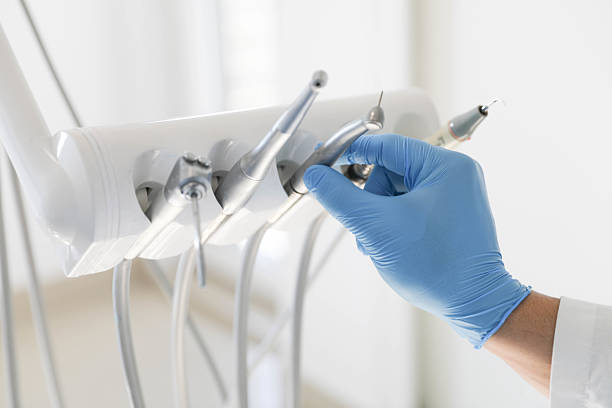 istock Dental Instruments and Gloved Hand in Modern Clinic 2232252821