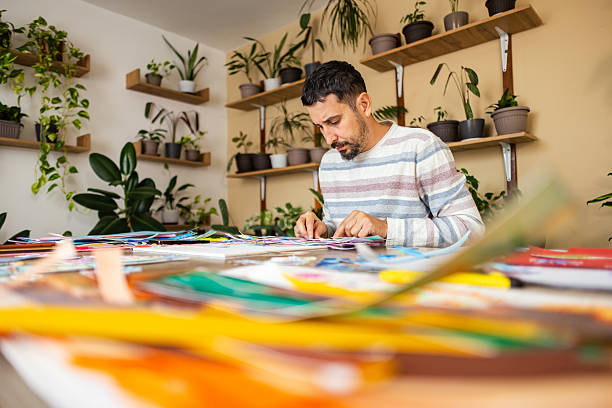 istock Focused artist sitting at desk 2232253083