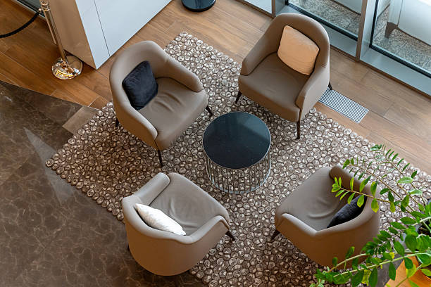 istock A modern hotel lobby with four plush armchairs and a meeting table 2232253936