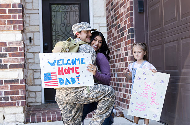 istock Soldier Homecoming: Family Welcomes Dad Home 2232254353