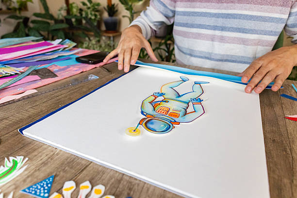 istock Artist creating collage artwork at home 2232256190
