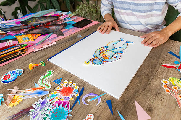 istock Artist creating collage artwork at home 2232256197