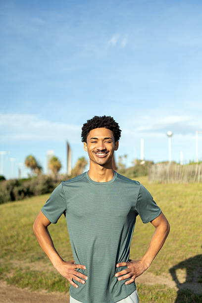 istock Young athlete smiling and resting after training outdoors 2232256756