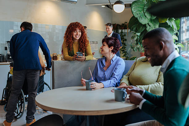 istock Diverse business team enjoying coffee break in modern office 2232257040