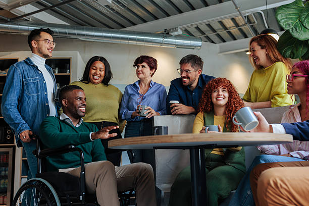 istock Diverse business team enjoying coffee break, discussing and smiling together 2232257044