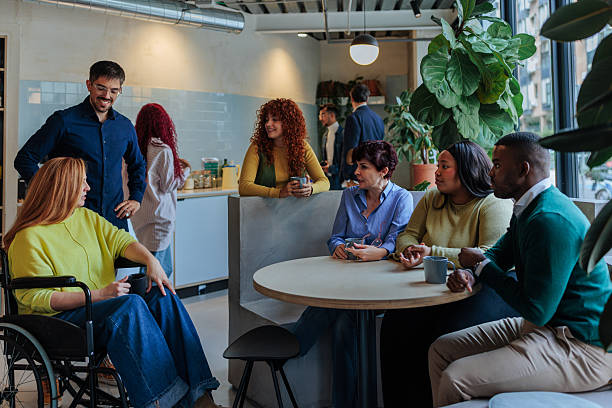 istock Diverse business team enjoying coffee break in modern office space 2232257048