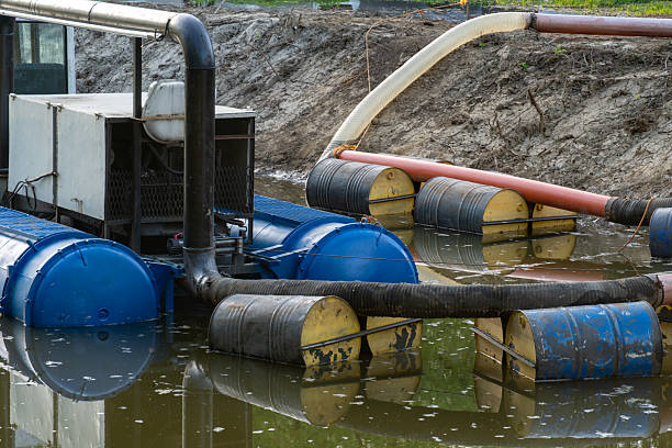 istock Marine equipment operates on still water for pollution control and environmental cleanup project in a rural area 2232257673
